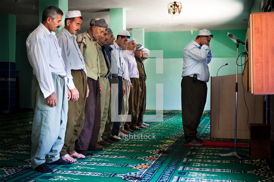 Imam leading Namaz prayers at Mosque with other Muslim Kurdish men