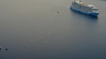 Cruiseship docked at santorini bay in greece