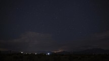Timelapse of a night thunderstorm with lightning and stars