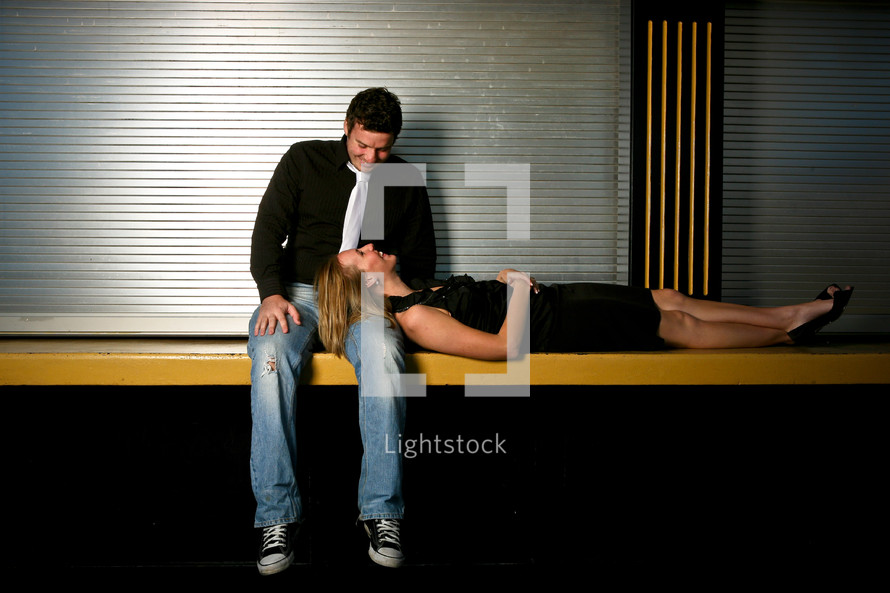 woman lying her head on a man's lap