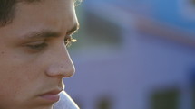 Close up of a teenage boy in deep thought