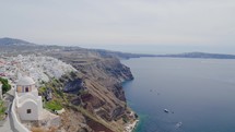 Panoramic view of Santorini island. Panning shot showing cruise ship docked