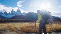 Hiker in Patagonia in Argentina with the iconic Fitz Roy mountains in the background, Patagonia, South America.

