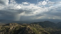 Timelapse of monsoon thunderstorms over rugged desert mountains