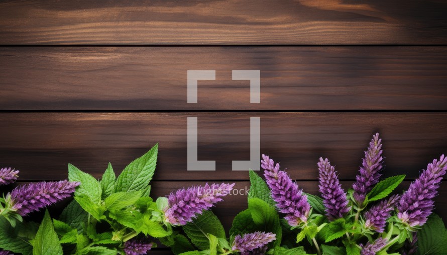 Fresh mint and flowers on wooden background. Top view with copy space