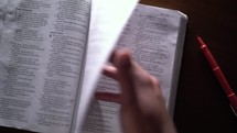 personal Bible study, turning pages of a Bible 