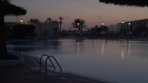 resort pool at dusk 