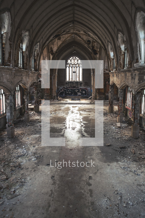 Sanctuary shot of a deteriorating and abandoned church.