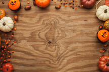 fall themed border on wood background 