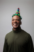 man wearing a party hat 