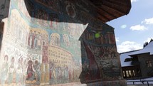 Handheld shot View From Exterior Of The Famous Voronet Monastery In Romania