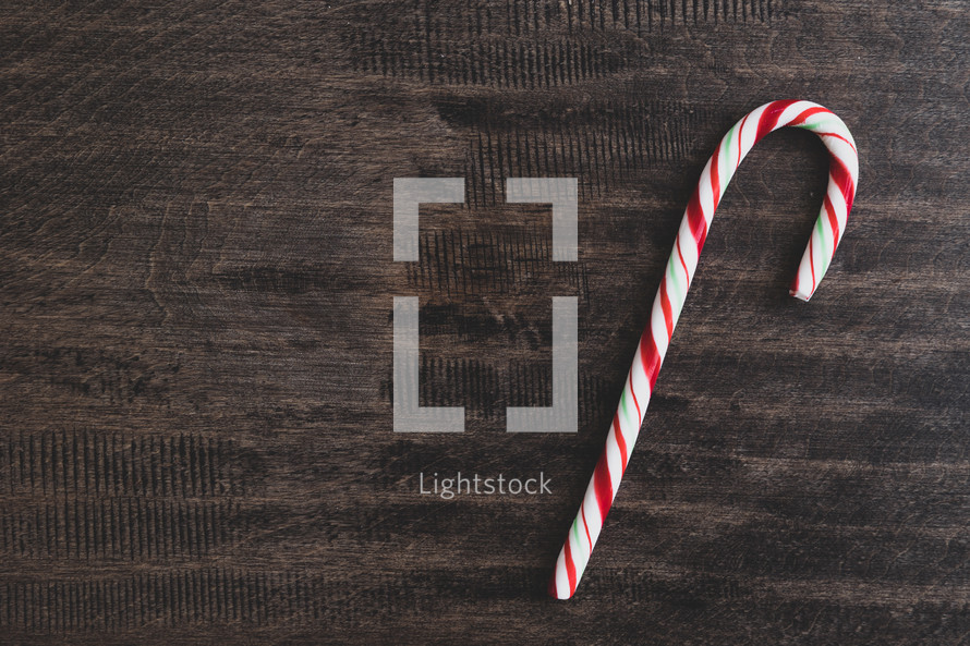 candy cane on a wood background 