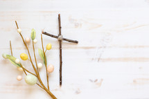 cross of sticks and Easter decorative spray 