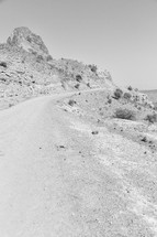 dirt road through a desert landscape 