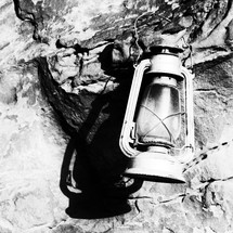 antique lantern on a rock 