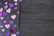 pink paper hearts and cross of sticks 