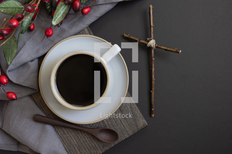 coffee and red berries, with cross, from above