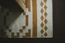 A rug with a geometric pattern.