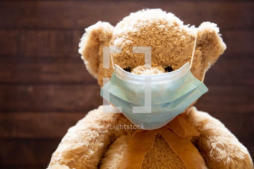 teddy bear wearing a face mask 