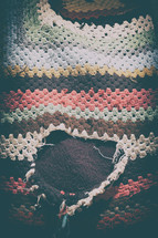 torn knit blanket 
