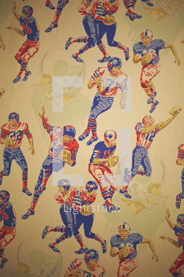 a wall with vintage sports wallpaper
