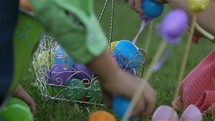 children gathering eggs at an Easter Egg Hunt 
