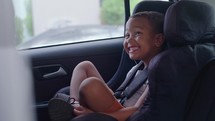 Boy screaming sitting in a car interior
