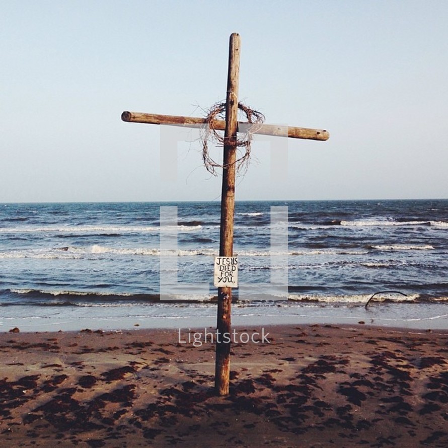 a cross and a crown of thorns on a beach - Jesus Died for You 