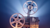 Vintage 8mm film projector, rotating reels. Nostalgic charm of classic cinema. Analog home player theater. Oscar, Hollywood, cinematograph concept. High quality 4k footage