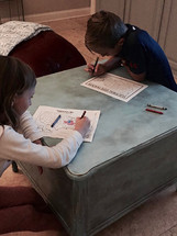children watching election results on election night and coloring a political map of the United States red or blue 
