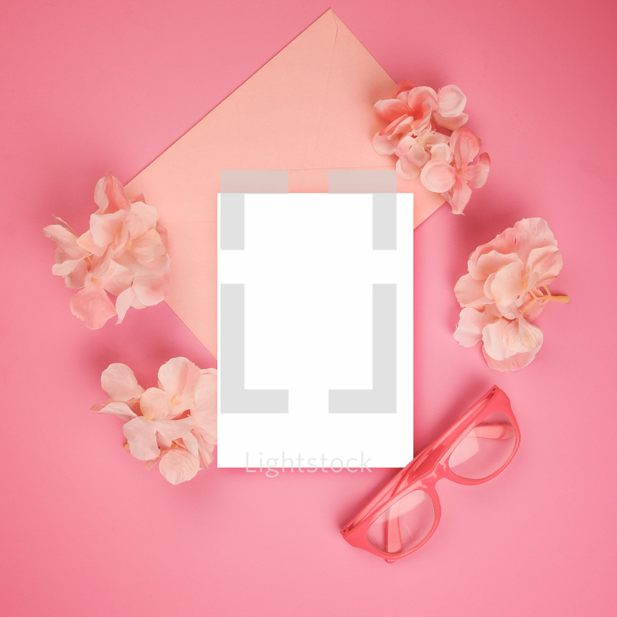 pink background and white envelope 