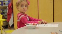 toddler girl coloring at Sunday School 