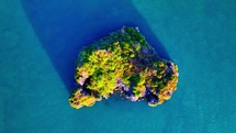 Aerial drone video of tropical paradise exotic island. Top down aerial of island. 