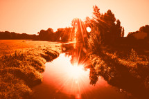 sunburst on a pond 