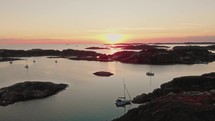 drone flies over Swedish archipelago at sunset in skarhamn