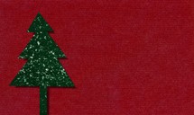 cardboard christmas tree over red background with copy space