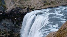 waterfall flowing over a cliff 