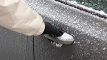 Trying to open frozen car door,