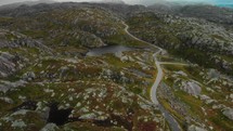 drone flies over mountains in norway