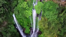 Aerial view of Bali Sekumpul waterfall in lush tropical forest 4k

