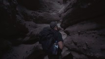 a man exploring a canyon 