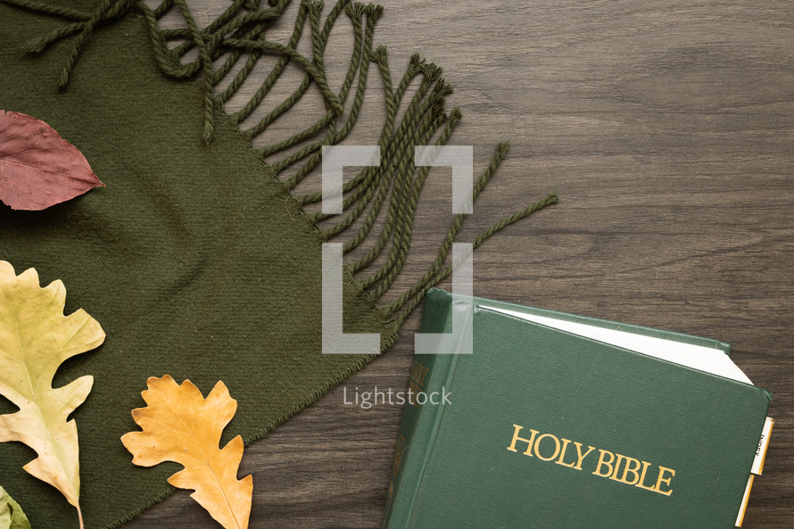 fall leaves on a green scarf and Holy Bible 