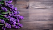 Lavender flowers on wooden background. Top view with copy space