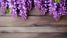 Purple lupine flowers on wooden background. Top view with copy space