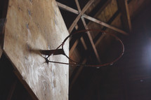 an old basketball hoop in a barn 
