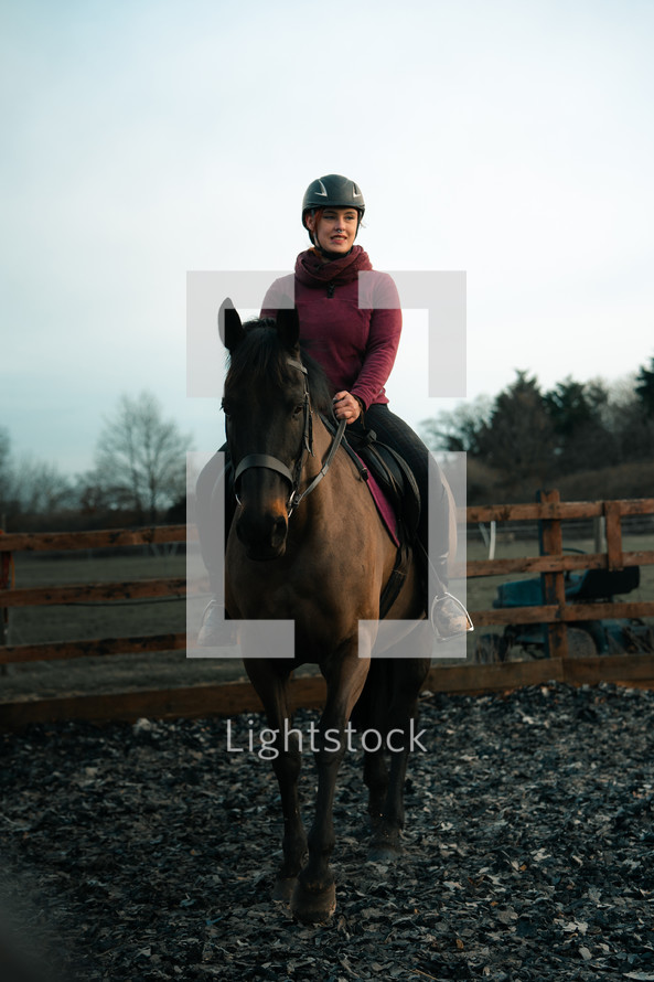 Horse riding woman on horseback, equine paddock, equestrian menage