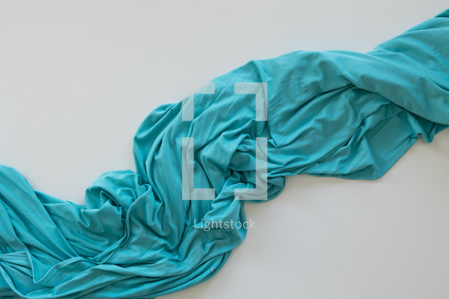 Background of teal blanket on white