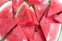 watermelon slices on a wood background 