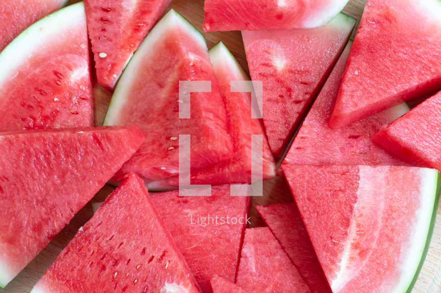 watermelon slices on a wood background 