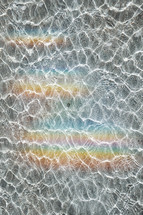 rainbow reflected in the water, abstract background